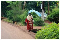 Woman walking down the road.