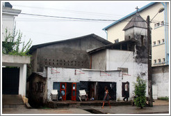 Church, with woman walking past.