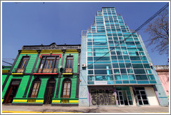 Old building (green, black, yellow, red) and new building (blue glass).  Dardignac, Bellavista.