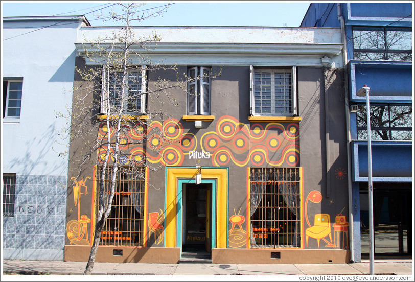 Pituka, brown building with yellow and orange swirls, Pur?ma, Bellavista.