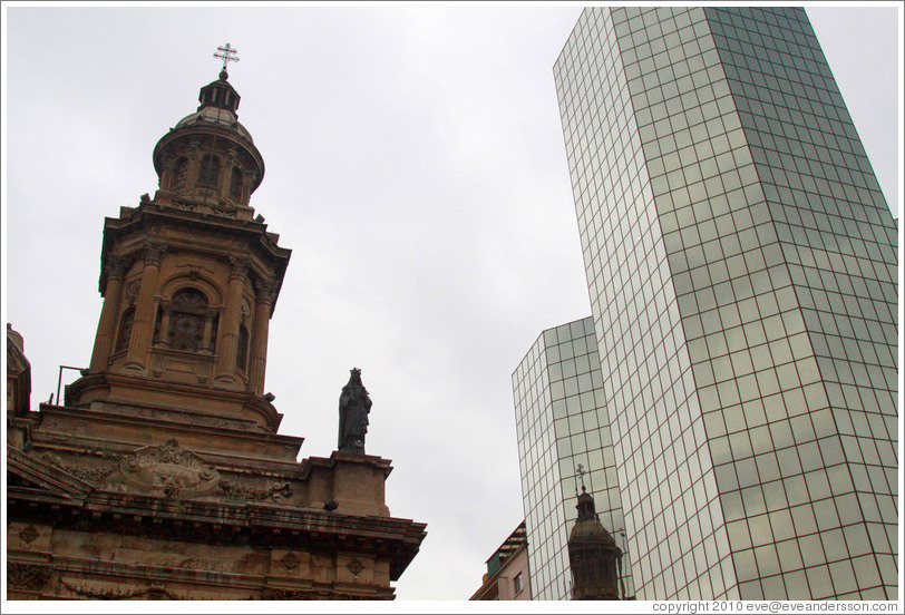 A tower of the Cathedral Metropolitana and a modern building, Plaza de Armas.