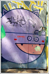 Graffiti: spherical lavender creature, perhaps a cat.  Constituci?Bellavista neighborhood.