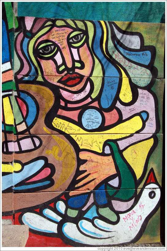 Mural: woman holding child, guitar and bird.  Fernando M?uez de La Plata, Bellavista neighborhood.