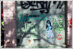 Graffiti: two girls, one of whom is creating graffiti of her own.  Santa Filomena near Ernesto Pinto Lagarrigue, Bellavista neighborhood.