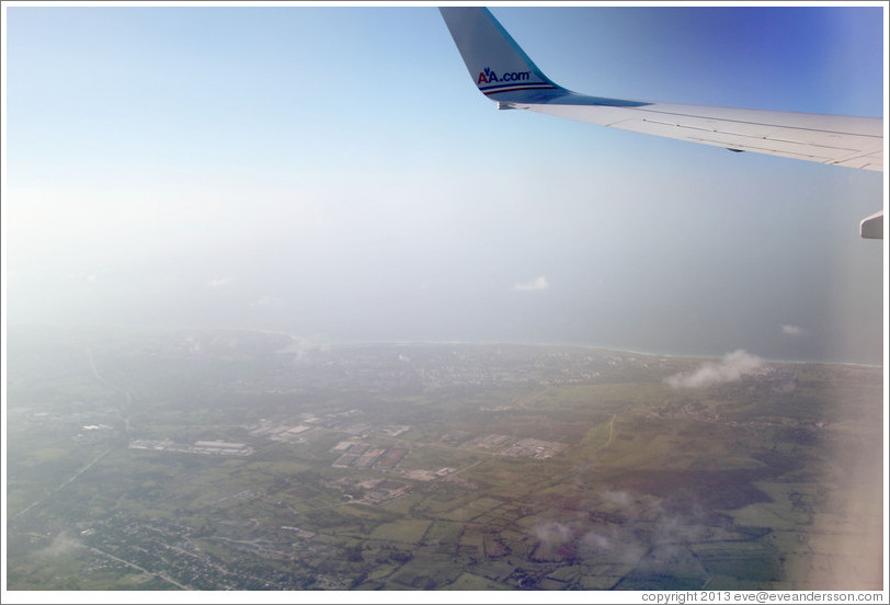 Coast of Cuba, seen through window of American Airlines airplane.