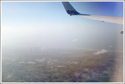 Coast of Cuba, seen through window of American Airlines airplane.