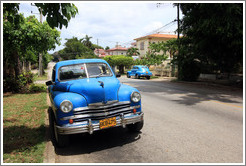 Blue cars on 7th Avenue.