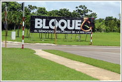 A sign near the airport reading, "Bloque. El genocidio m&aacute;s large de la historia." This refers to the United States' trade embargo against Cuba, saying it's the longest genocide in history.