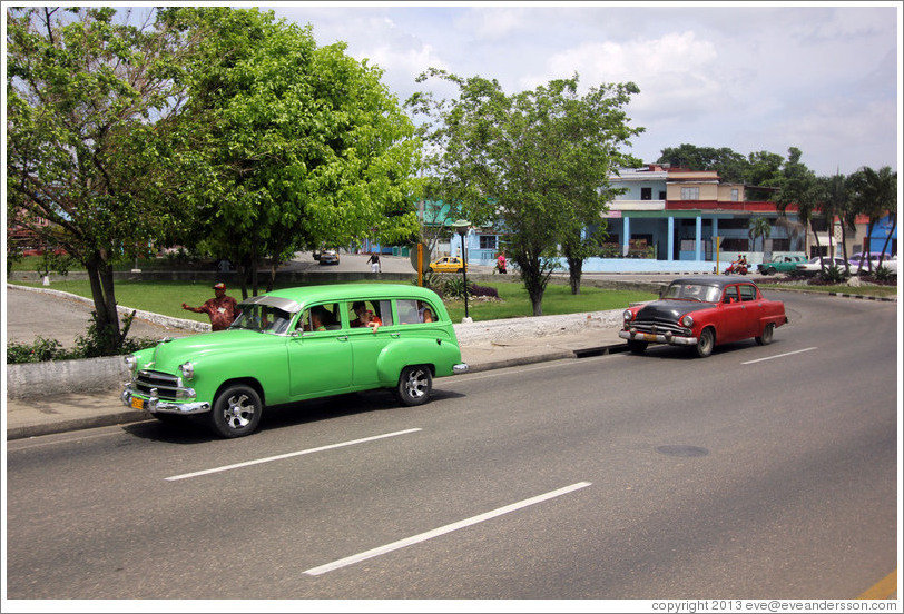 Green car and red and black car, 41st Avenue.