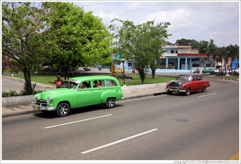 Green car and red and black car, 41st Avenue.