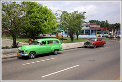 Green car and red and black car, 41st Avenue.