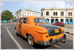 Orange and black taxi, Avenida Salvador Allende (Carlos III).