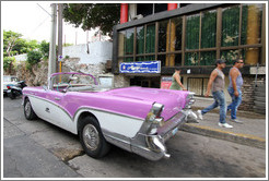 Pink and white car, corner of 21st Street and O Street.