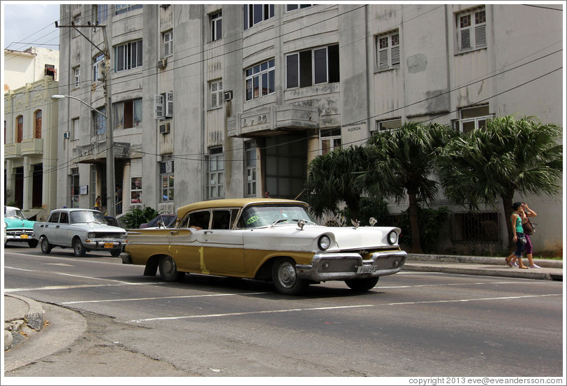 Gold and white car, corner of 25th Street and L Street.