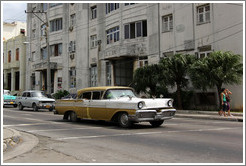 Gold and white car, corner of 25th Street and L Street.