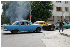 Blue car, smoking, corner of 25th Street and L Street.