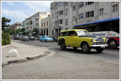 Yellow and black car, corner of 25th Street and L Street.