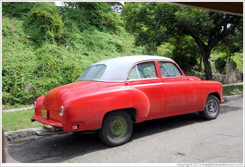 Red and white car, 25th Street.