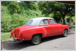 Red and white car, 25th Street.