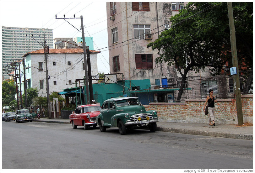 Red car and green car, 25th Street.