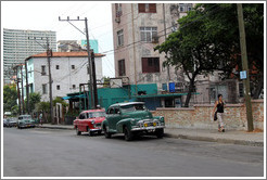 Red car and green car, 25th Street.