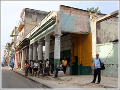 People standing near columns of a building, Calle Padre Varela (Belonscoain).