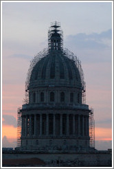 Scaffolding around the cupola of El Capitolio at dusk, seen from the rooftop of Hotel Saratoga.