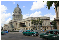 Green cars in front of El Capitolio.