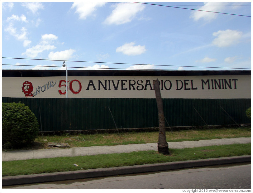 Words painted on a wall: "50 Aniversario del MININT" (Cuba's Ministry of the Interior). Calle Perla, La V&iacute;bora neighborhood.
