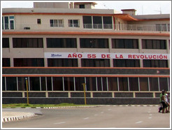 Banner reading "A&ntilde;o 55 de la Revoluci&oacute;n" ("Year 55 of the Revolution"), implying the revolution is ongoing.