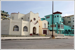 Beige and aqua buildings on the Malec&oacute;n.