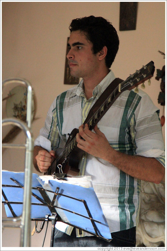 Guitarist Hector Quintana, performing at a private home in Miramar.