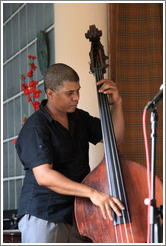 Double bassist Omar Gonzales, performing at a private home in Miramar.