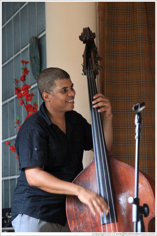 Double bassist Omar Gonzales, performing at a private home in Miramar.