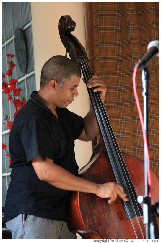 Double bassist Omar Gonzales, performing at a private home in Miramar.