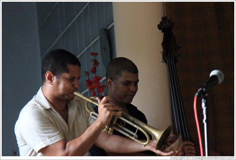 Trumpet player Yasek Manzano Silva and double bassist Omar Gonzales, performing at a private home in Miramar.