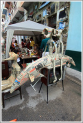 Papier-m&acirc;ch&eacute; mice riding a creature on top of an old television set, Proyecto Salsita.