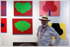 Cuban artist Juan Moreira in front of his artwork in the studio he shares with Alicia Leal.