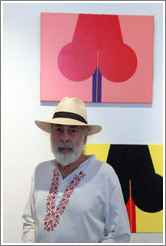 Cuban artist Juan Moreira in front of his artwork in the studio he shares with Alicia Leal.