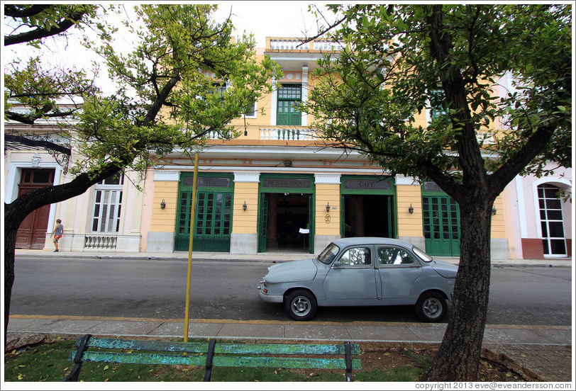 Light blue car in front of Hotel/Restaurante/Caf&eacute; Velasco.