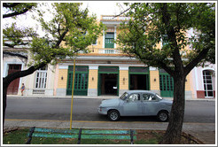 Light blue car in front of Hotel/Restaurante/Caf&eacute; Velasco.