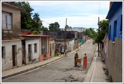 Woman buying something from a vendor in the street.