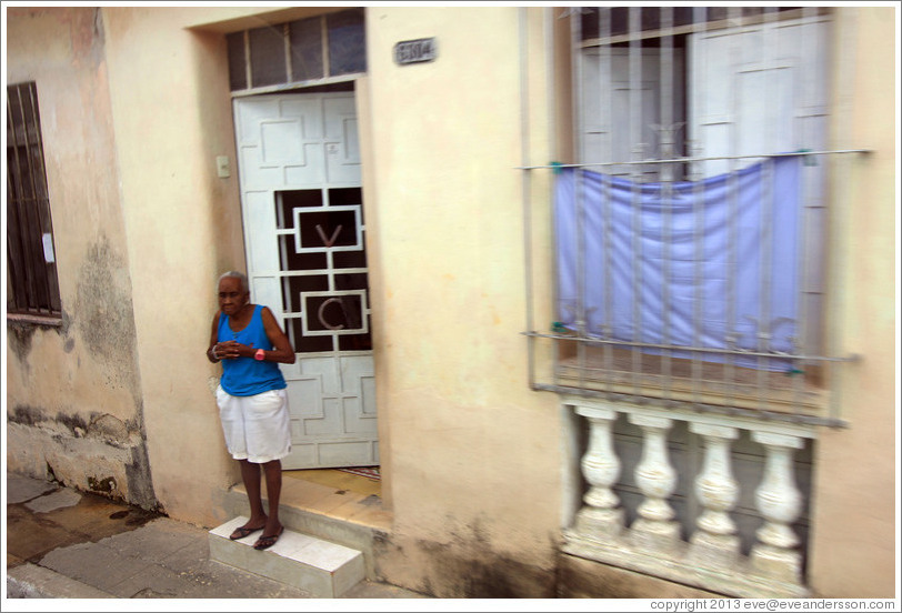 Woman in a doorway.