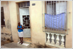 Woman in a doorway.