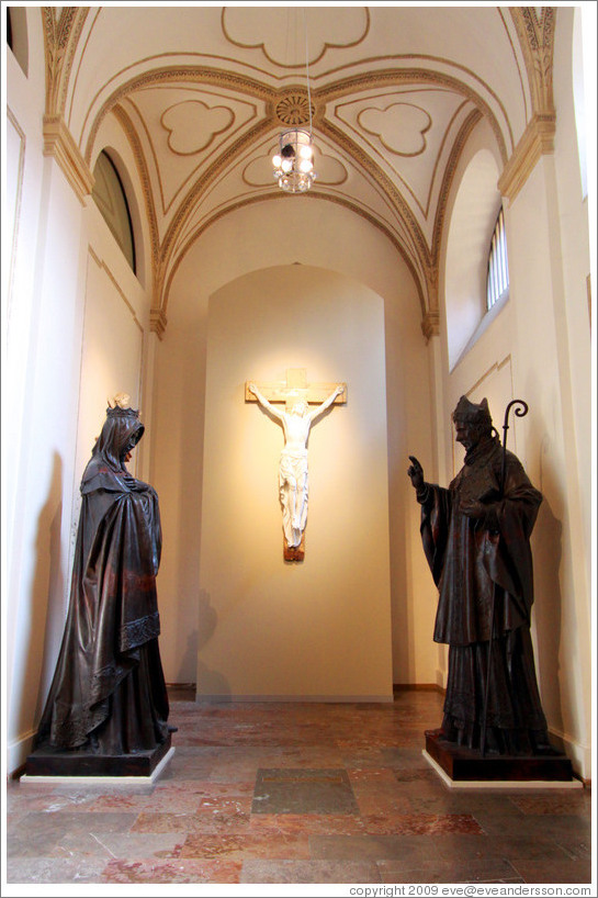 Plaster cast of St. Adalbert (Vojt&#283;ch) sculpture and model of a St. Agnes sculpture by Josef V?av Myslbek.  Behind is Christ on a Cross (1843) by Emanuel Max.  National Gallery, Prague Castle.