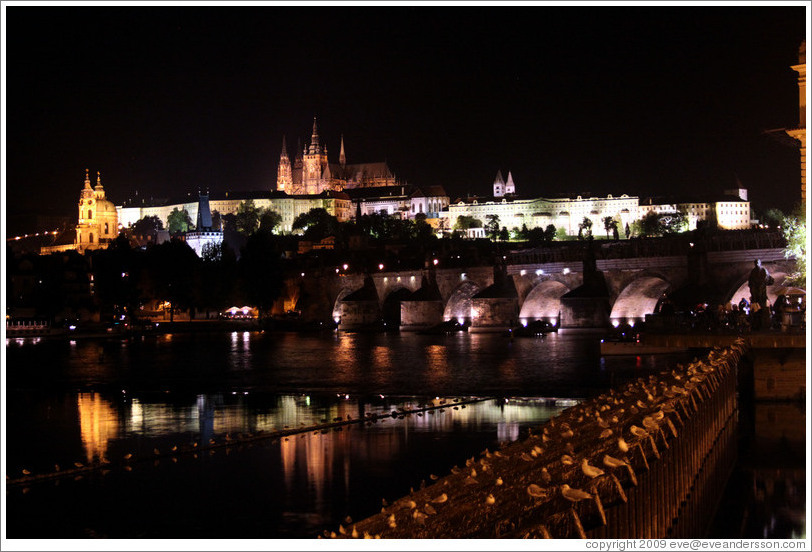 Prague Castle across the Vltava River at night.