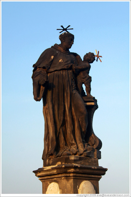 Man and child, adorned with beanies, Charles Bridge (Karl&#367;v most).