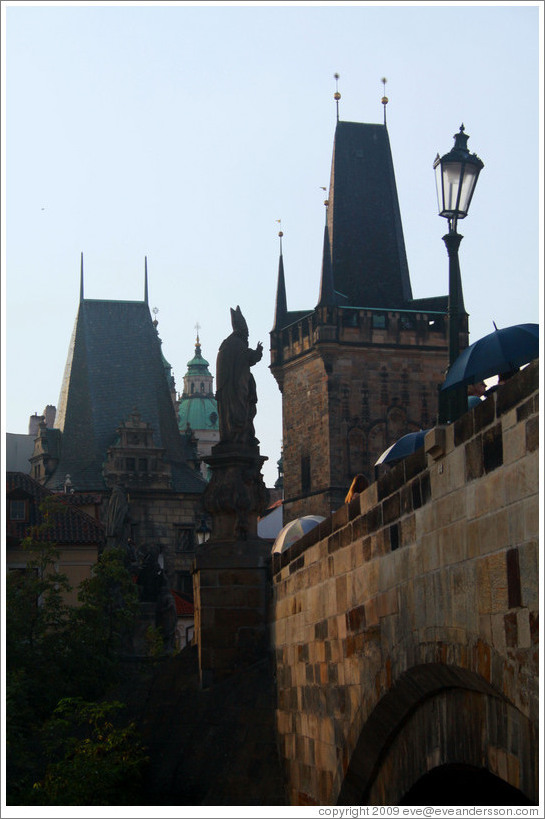 Sculpture of a bishop making a peace-sign (or similar hand gesture), Charles Bridge (Karl&#367;v most), viewed from Kampa.