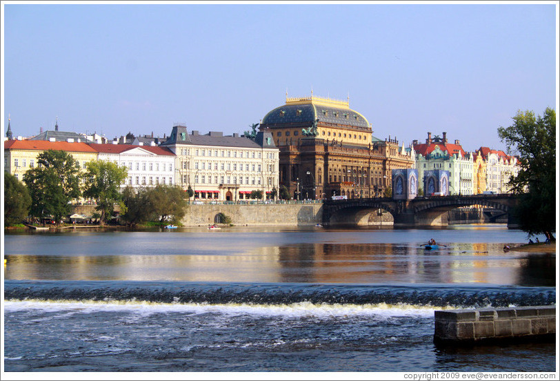 View of Nov?&#283;sto, including the National Theatre (N?dn?ivadlo), from Kampa.  A change in the water level of Vltava River can be seen.