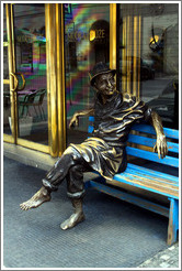 Sculpture of a barefoot man sitting, in front of the Modr?&#367;?e (Blue Rose) hotel, Ryt?345;sk?Star?&#283;sto.